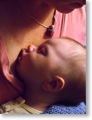 Sleeping on her mom's chest