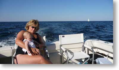 Cyan's built for speed, hanging out with mom on the stern of the boat.