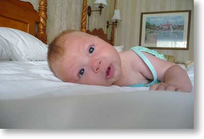 Cyan tries out the bed at our room in The Grand Floridian