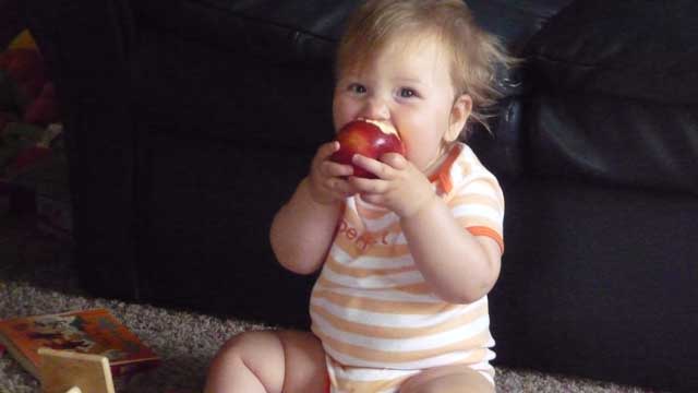 Eating an apple, before it hit te floor