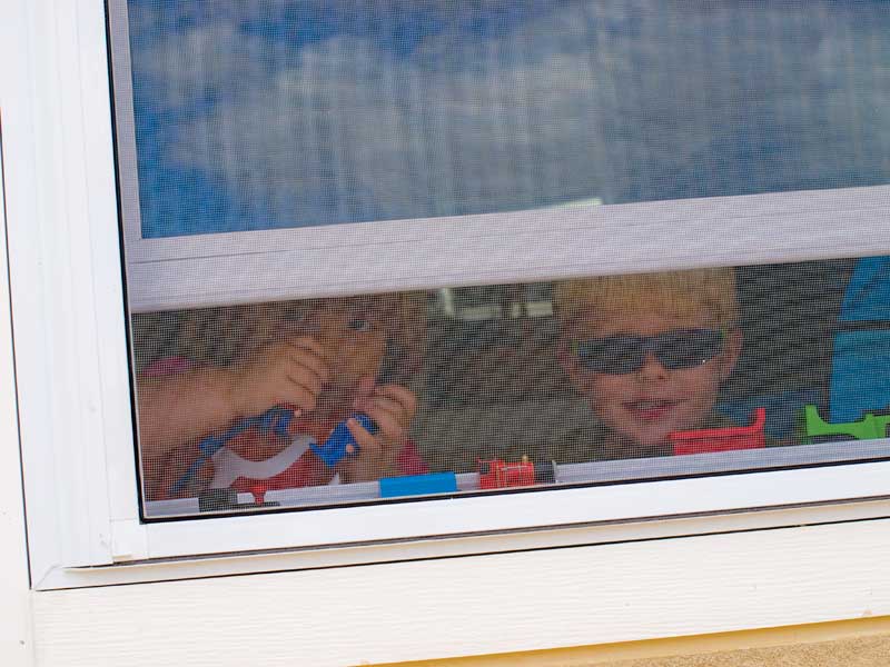 Cyan and Landen through window