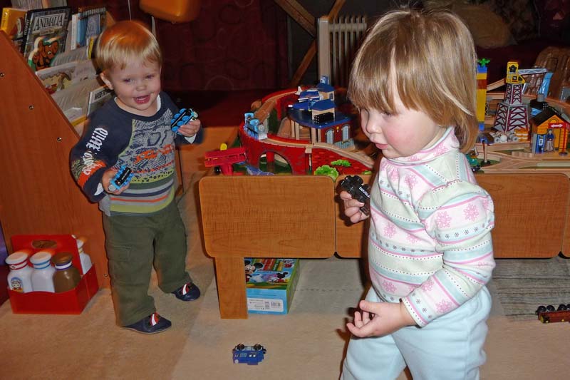 Playing with trains with her friend Landon